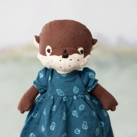 portrait of clara otter wearing riverbank dress