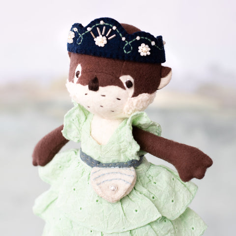 portrait of clara otter wearing her shell pouch tied around her waist
