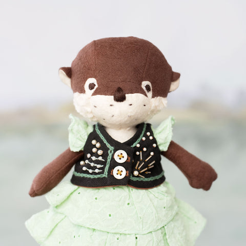 portrait of clara otter wearing foamy rapids gown with pearl collecting vest