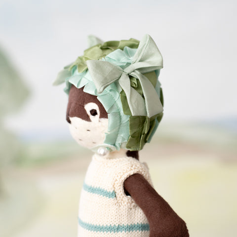 side angle portrait of clara otter wearing pondweed swim cap