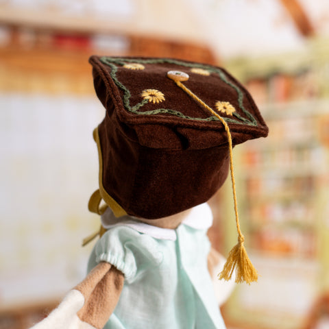 back view portrait of thinking cap on lucy owl