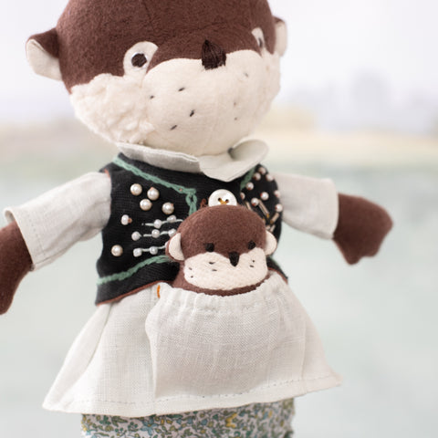 portrait of clara otter carrying her mini otter in her shirt pocket