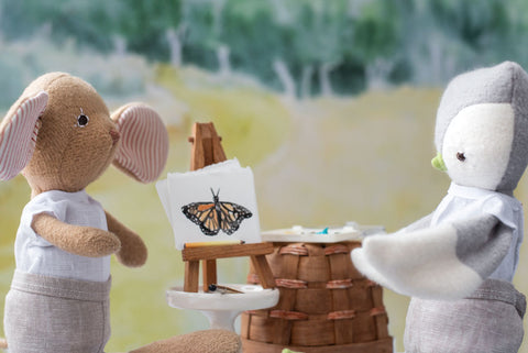 Annicke Mouse and Jeremy Owl look at butterfly painting