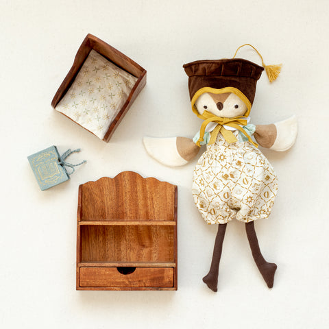 editorial of lucy owl with her library books and wooden furniture