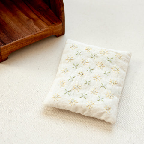 closeup of embroidered cushion